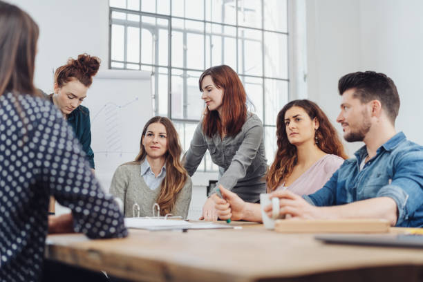 istock Dedicated young business team in a meeting 1241340515