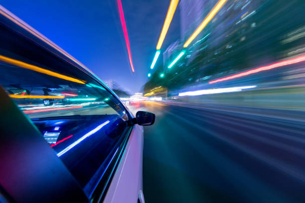 istock abstract background of speed traffic light trails with circle bokeh 1241346655