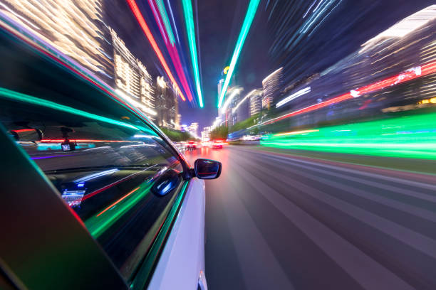istock abstract background of speed traffic light trails with circle bokeh 1241347252