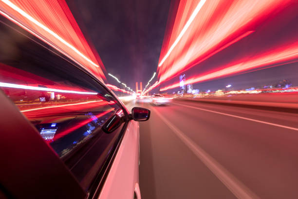 istock abstract background of speed traffic light trails with circle bokeh 1241347766