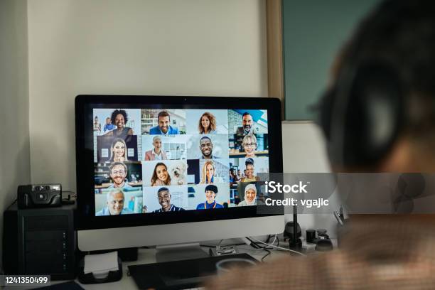 Businessman Working With Colleague Through Video Conferencing Stock Photo - Download Image Now