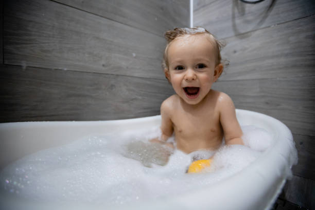 istock Cute Little Baby In Bathtub 1241363625