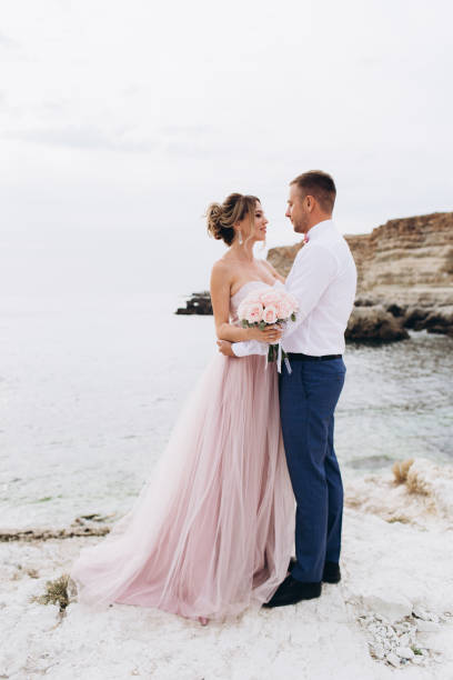 istock Loving couple on the seashore. Wedding. Newlyweds. 1241380292