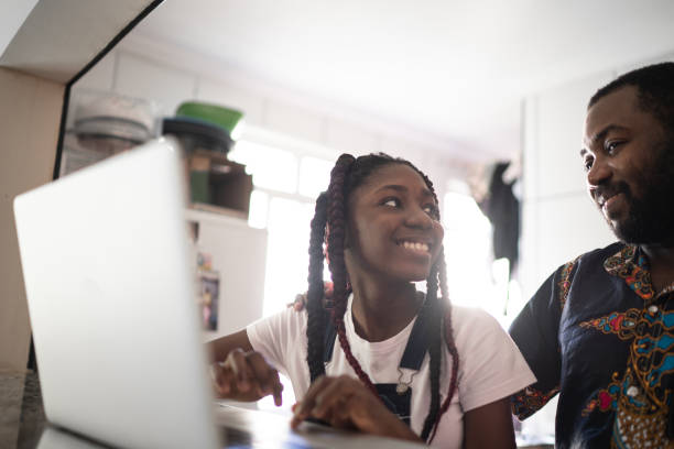 istock Dad helping his teenager doing homework at home 1241387550