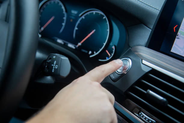 istock male finger presses the start stop engine button on a car dashboard. close-up, soft focus, in the background the dashboard and car speedometer in blur, side view 1241420582