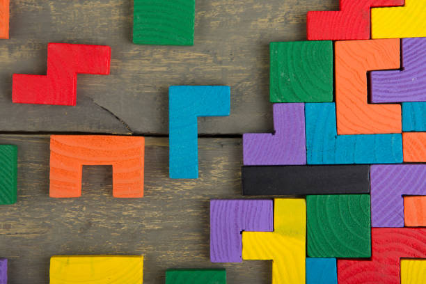 istock Creative solution for idea - business concept, jigsaw puzzle on the wooden desk 1241449155