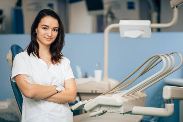 istock charming beautiful woman dentist at work place 1241450912