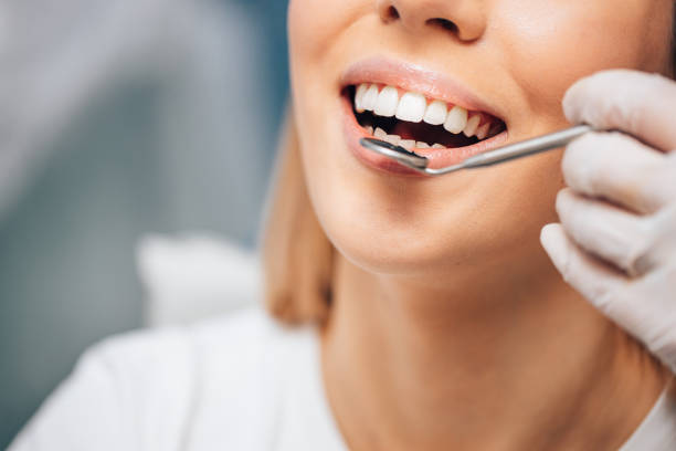 istock Teeth and hygiene concept. Young woman visit dentist 1241453741