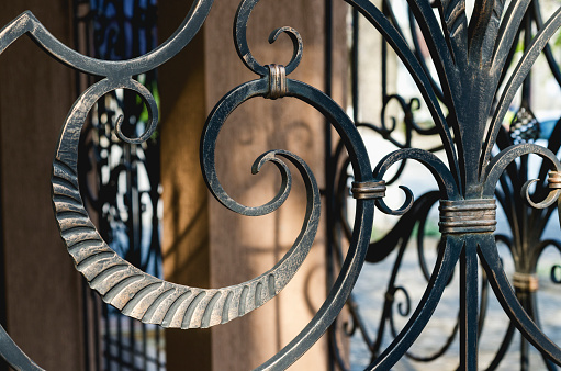 Full frame view of ancient bandstand cast iron decorated railing at dusk. Image suitable for background purposes.Mondoñedo, Lugo province, Galicia, Spain.