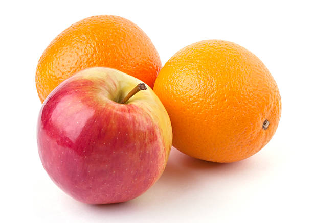 istock Two oranges and juicy apple 124147229