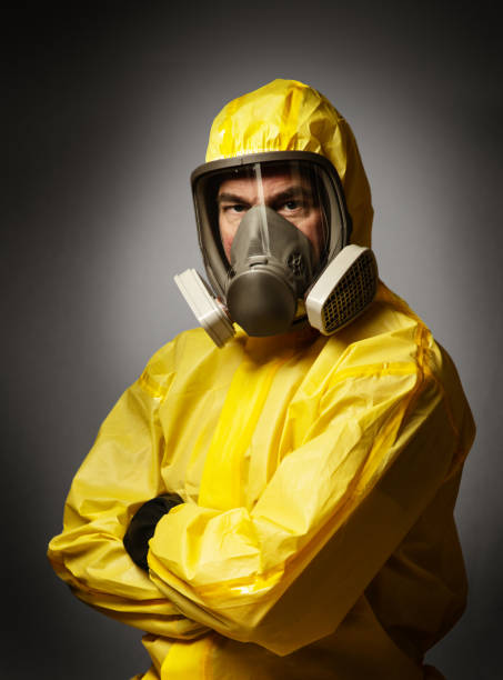 istock man wearing a hazmat suit and mask 1241472789