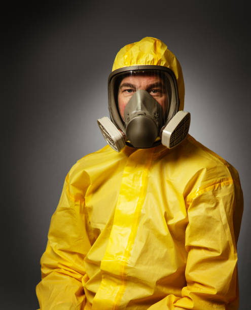 istock man wearing a hazmat suit and mask 1241473259