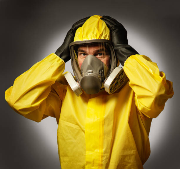 istock man wearing a hazmat suit and mask 1241475405
