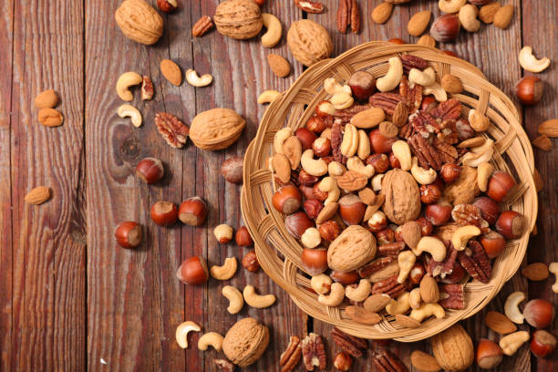 istock bowl with assorted of nuts fruits 1241482626