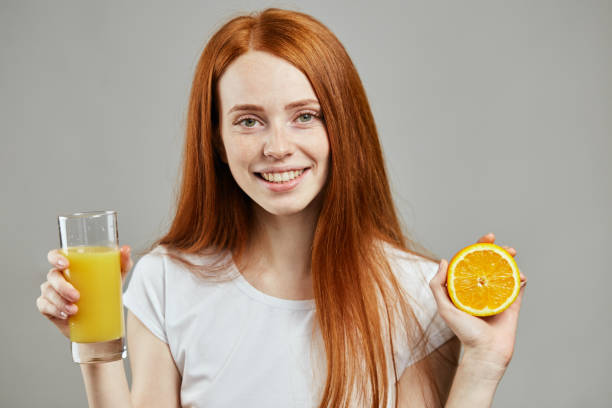 istock vitamin C. ginger girl having breakfast 1241488761