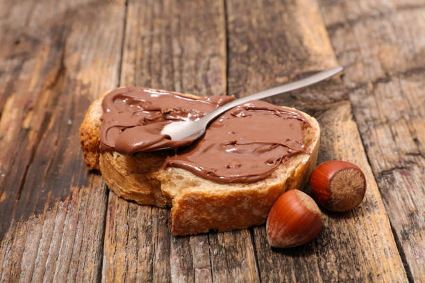 istock bread slice with chocolate spread on wood background 1241491044