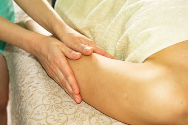 istock Relaxing massage. Masseur massaging a woman's hand. Close-up 1241502859