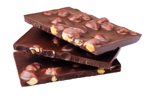 istock Pieces of chocolate with nuts on a white background. 1241506223