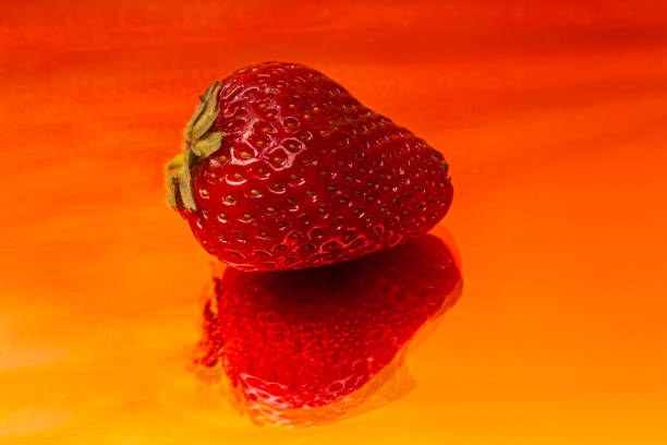 One fresh tasty strawberries on a art wavy background