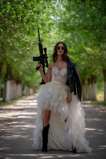 Bride and groom with guns