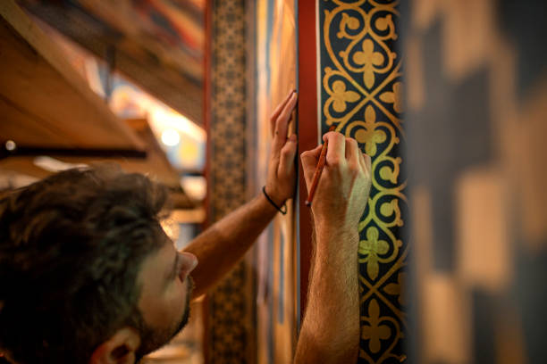 talented man is painting in a church - restoring art painting artist imagens e fotografias de stock