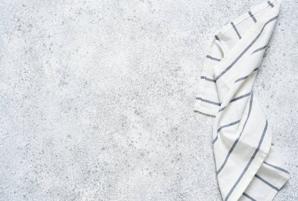 istock Concrete kitchen table with a napkin. Food background with place for text. 1241590964
