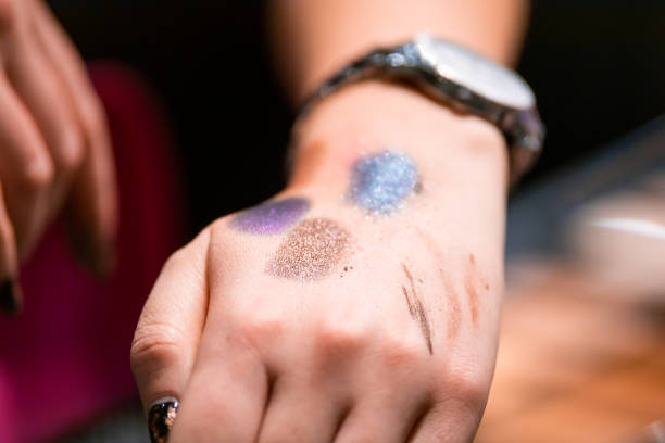 istock Customer woman testing cosmetics in beauty store before buying 1241598422