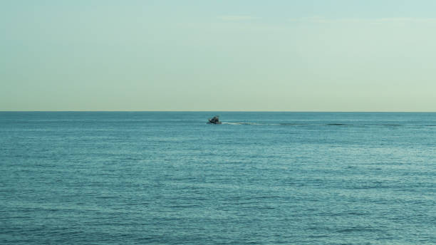 istock motor boat racing on the blue sea 1241607318