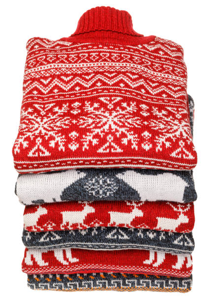 istock Stack of folded knitted Christmas turtleneck sweaters on white background 1241611837
