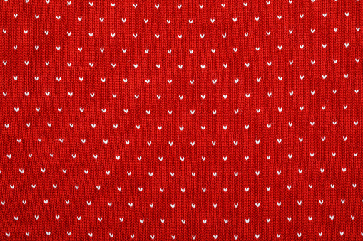 Real red knitted fabric textured background