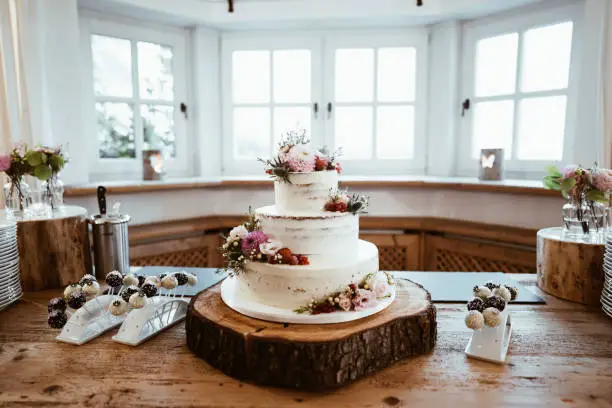 wedding cake with flowers on a table