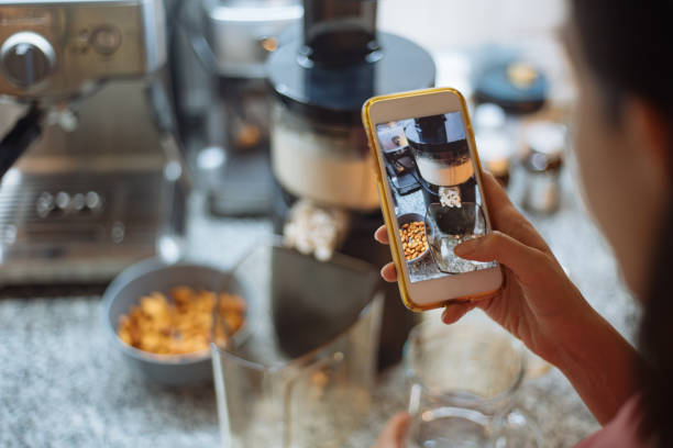 woman taking photo process of almond milk - cell human cell plant cell virus imagens e fotografias de stock