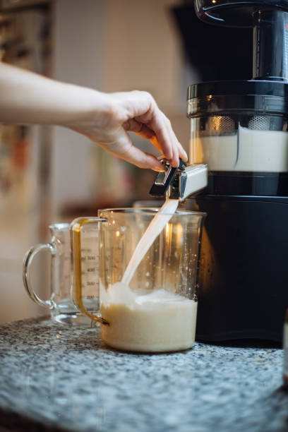 istock Woman making home made almond milk 1241616306