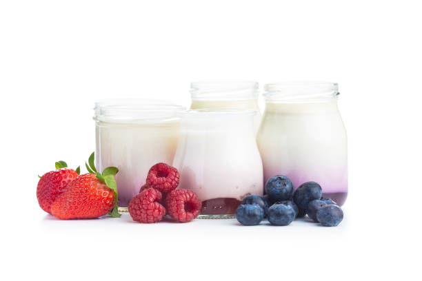 istock White fruity yogurt in jar and strawberries, blueberries, raspberries 1241616317