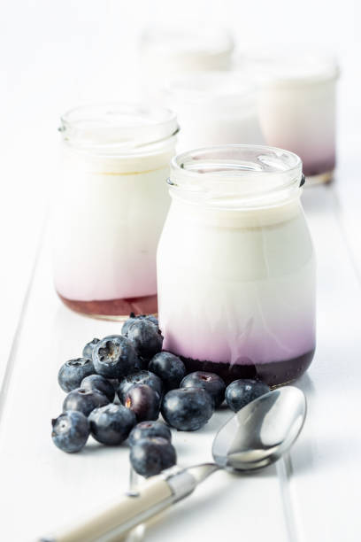 istock White fruity yogurt in jar and blueberries. 1241616354