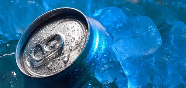 Photo of drink tin can iced submerged in frost ice, metal aluminum beverage