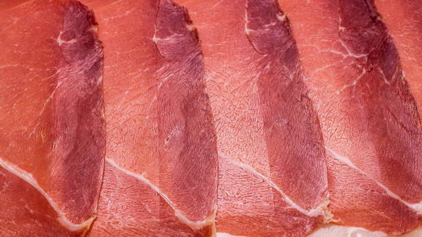 istock Tasty meat background, thinly sliced jamon. 1241618761