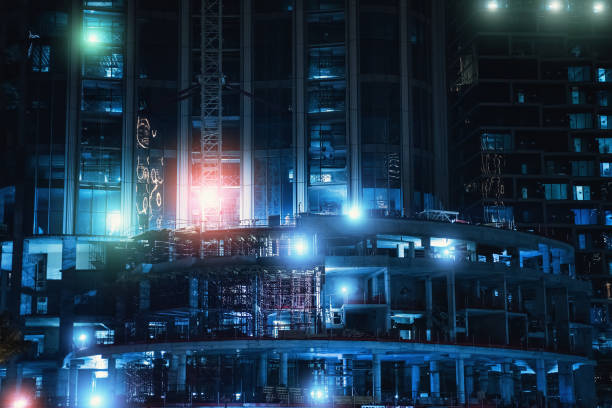 istock New high rise building construction site in Dubai at night. Fast Dubai development concept 1241619275