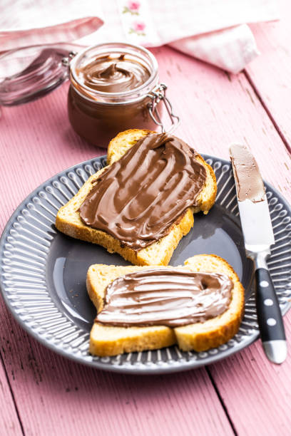 istock Toast bread with hazelnut spread. Sweet chocolate cream. 1241629100