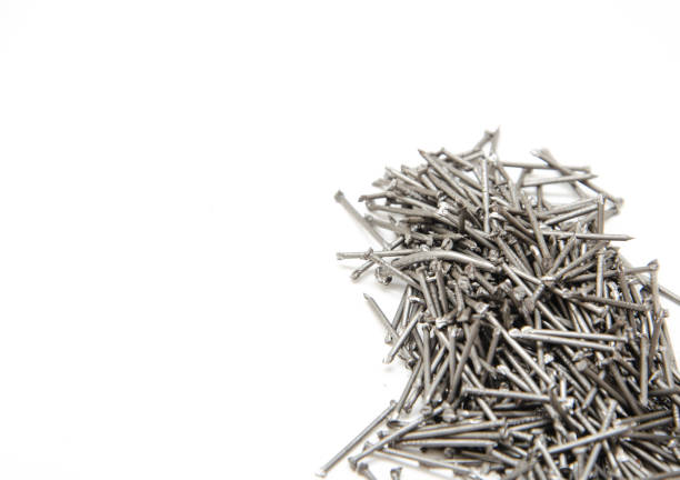 istock Nail. A pile of nails on a white background in macro. for text. 1241631943