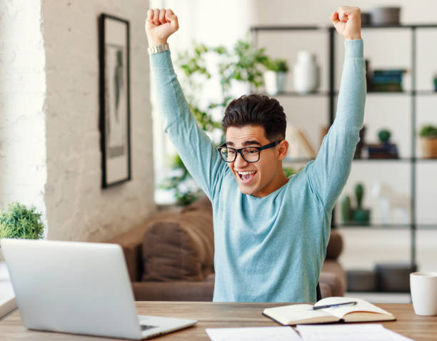 istock Happy ethnic student finishing homework 1241645822