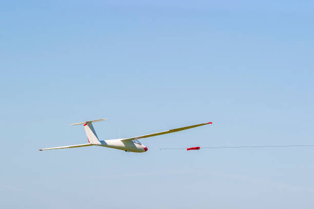 istock Model airplane flying at a blue sky 1241654261
