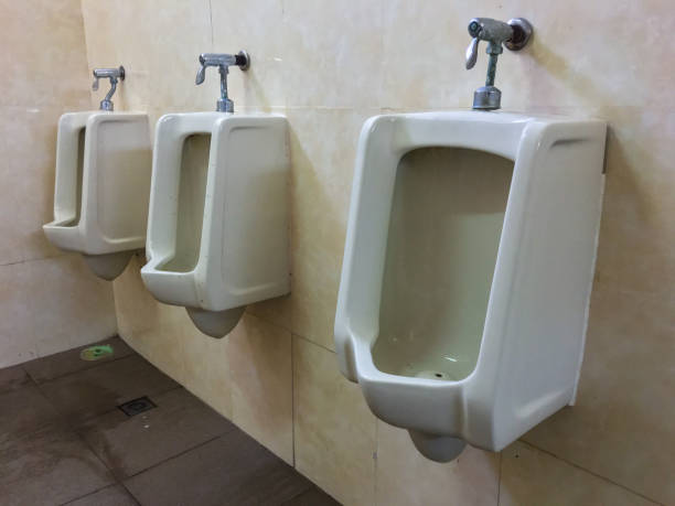 urinal is installed in the men's toilet. - toilet public restroom bathroom flushing imagens e fotografias de stock
