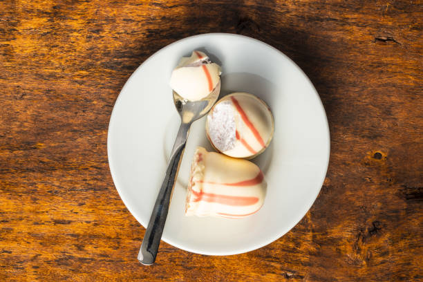 istock Sweet foam dessert. Marshmallow covered with strawberry icing. 1241660702