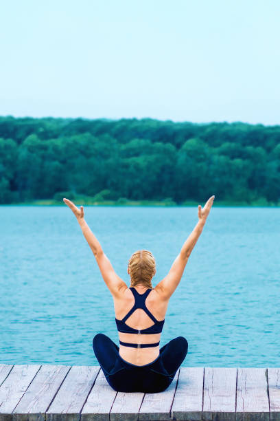 istock Young woman doing exercises outdoor 1241662436