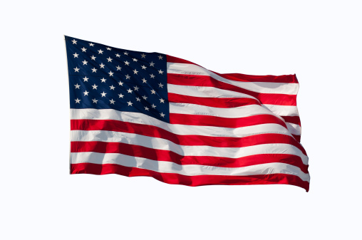 Image of american flag flying in the wind, isolated on white background.