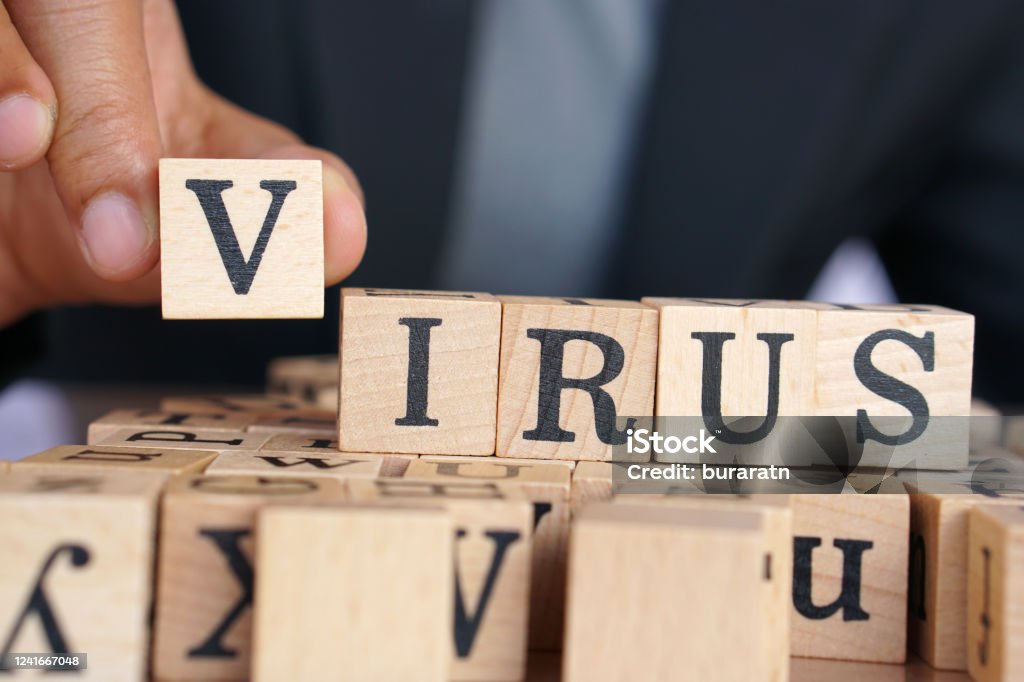 covid-19 writing in pieces of wood letters similar to in a scrabble game Tile Stock Photo