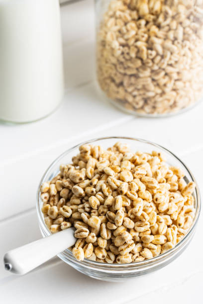 istock Puffed wheat covered with honey in glass bowl. Cereal breakfast. 1241670032