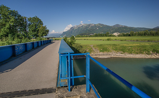 View over a blue bridge to Switzerland on a beautiful summer morning
