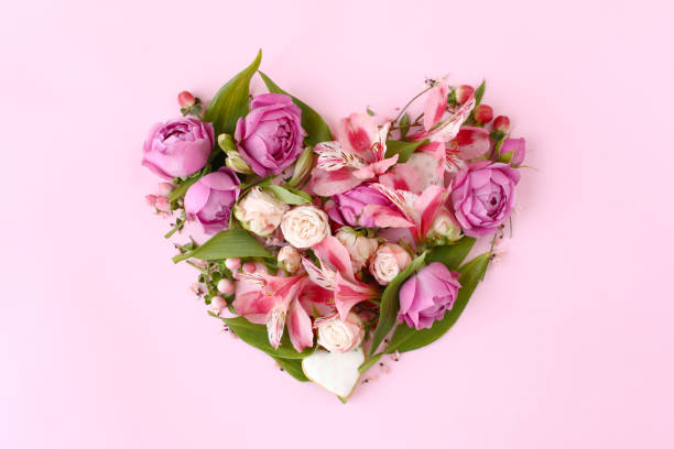istock Heart shaped floral composition on pink background. 1241685020